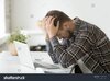 stock-photo-frustrated-depressed-man-holding-head-in-hands-shocked-by-bankruptcy-stock-downfal...jpg