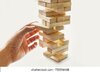 tower-wooden-blocks-mans-hand-260nw-755596468.jpg