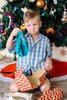 little-boy-pulling-a-sad-face-unhappy-with-a-gift-of-underpants-he-has-received-on-christm-au...jpeg