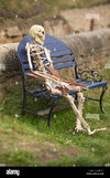 skeleton-sitting-on-bench-seaton-sluice-northumberland-GRKG5T.jpg