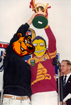 Bear and tony hold cup.png