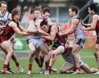 R16-12 Lauderdale\'s Phillip Bellchambers (centre) gets some attention from North Hobart.jpg