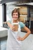 stock-photo-pretty-barista-smiling-at-camera-holding-disposable-cup-at-the-coffee-shop-218878096.jpg