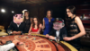 dealer-shuffles-the-men-and-women-in-a-casino_skxbhhzi__F0000.png